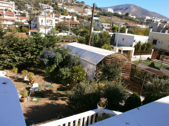 TheRealtyAgency-Lagonisi-1st floor veranda front garden view and garage