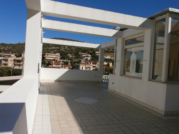 TheRealtyAgency-Lagonisi-1st floor veranda side with front view